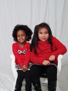 Naomi kept smiling and closing her eyes because she didn't like the flash.