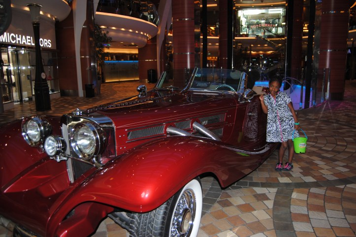 Naomi really wanted to get her picture taken next to this car. It was parked on the ship.